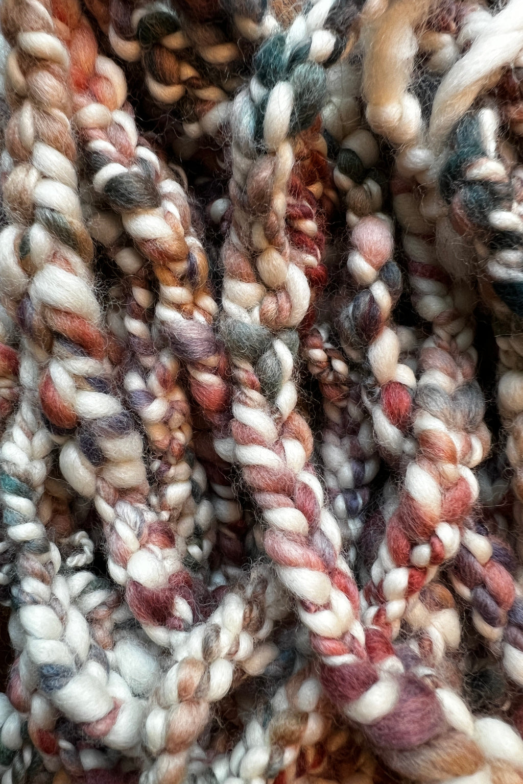 Painted Skein hand-dyed hand spun, hand crafted Sedona Market trim featuring a multi-colored trim palette of teal, terracotta, purple-lavender, and sage beautifully contrasted against a crisp cream base.