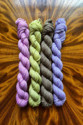 Set of four hand dyed 20-gram mini skeins in tonal hand-dyed yarn colorways designed to coordinate with The Painted Skein’s Monet Sunrise Masterpiece Collection.