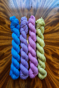 Set of four 20-gram hand dyed mini skeins in tonal hand-dyed yarn colorways designed to coordinate with The Painted Skein’s Kimt's The Virgin Masterpiece Collection.