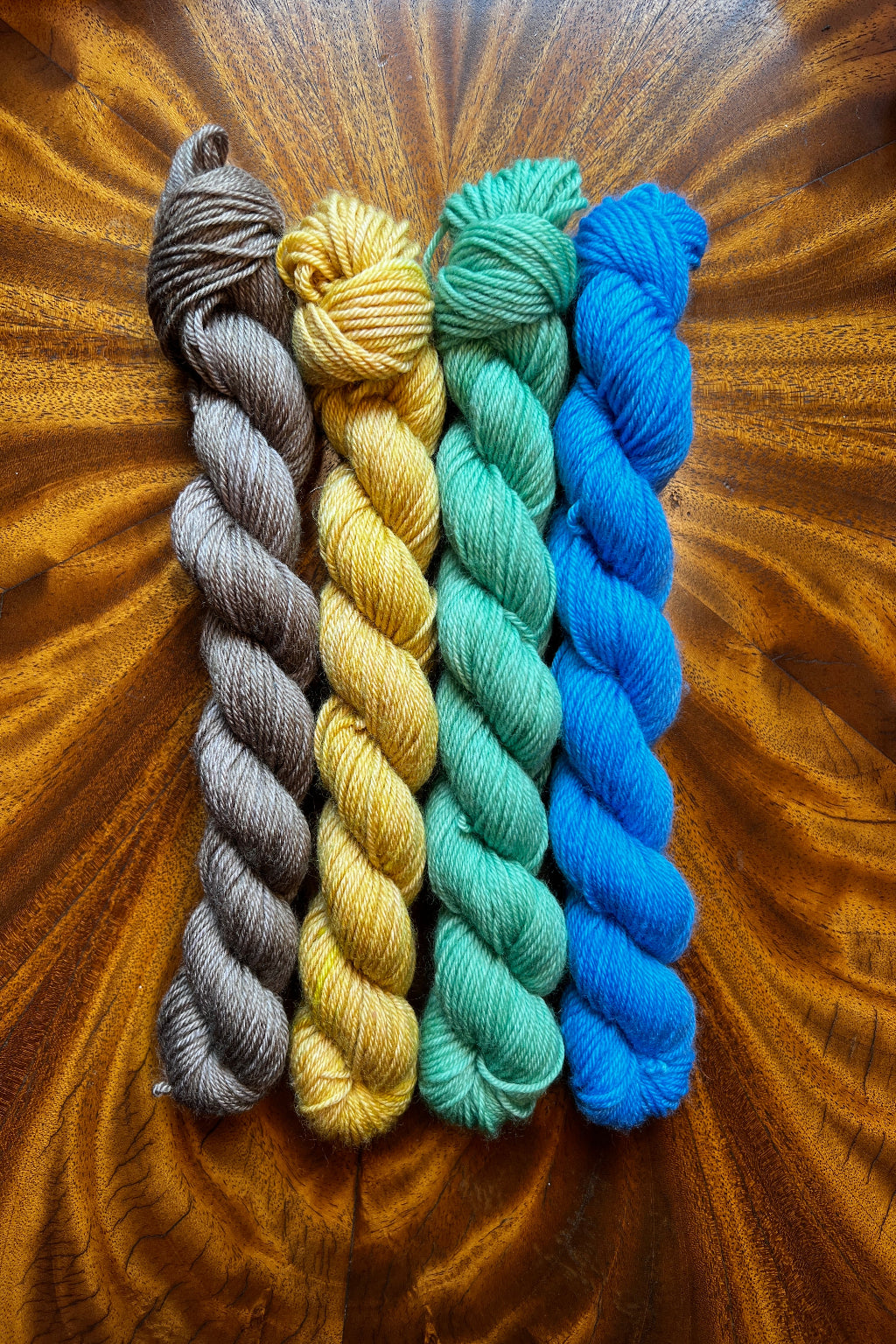 Painted Skein Mini skein set 20g x 4. Hand dyed in Minneapolis to coordinate with Lady with Fan Masterpiece collection in olive brown, tobacco yellow, dragon green and sapphire.