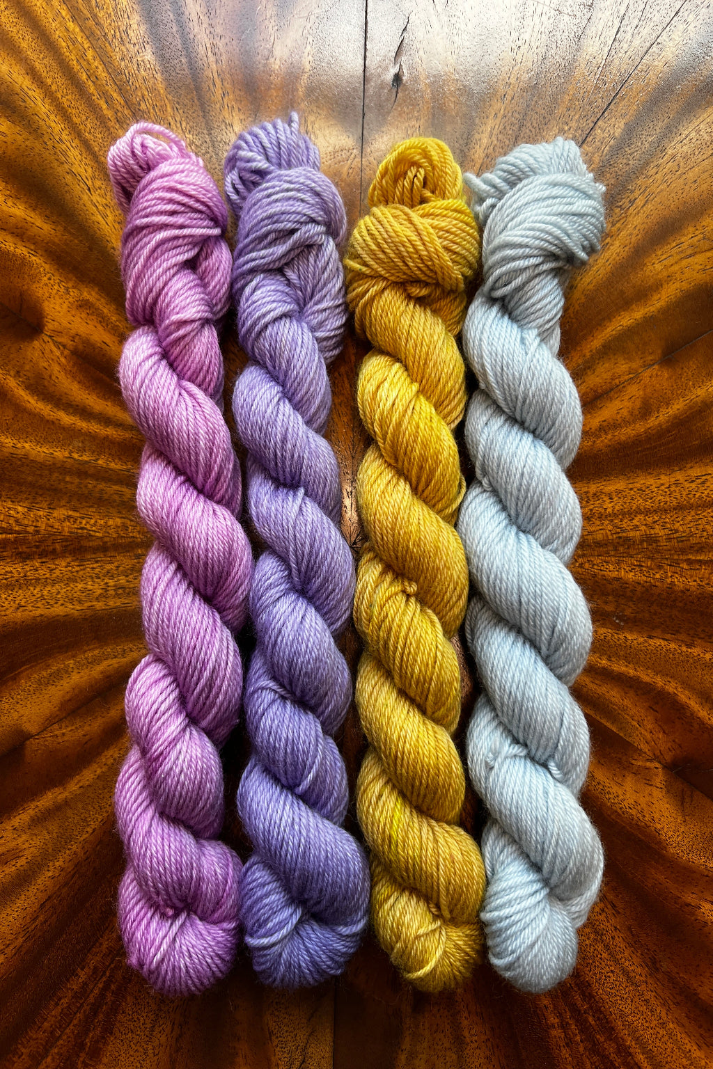 Mini skein set 20g x 4. Hand dyed in Minneapolis to coordinate with Summer Haze colorway from Masterpiece collection in orchid, lavender, tobacco and platinum.