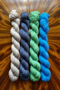 Painted Skein hand dyed yarn 20g x 4 mini skein set in driftwood, steel blue, dragon green and sapphire blue. Dyed to coordinate with the best selling Starry Night colorway. Hand dyed in Minneapolis.
