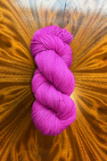 100g skein of Purple Pop merino yarn, hand dyed in Minneapolis to coordinate with the Masterpiece collection.