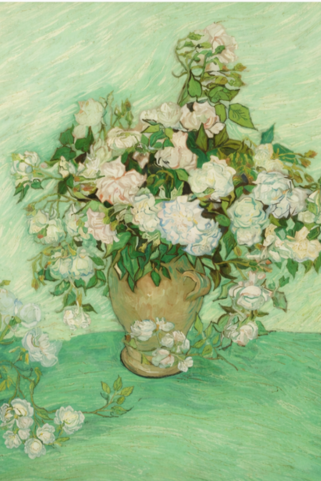 Vase with flowers on a green surface