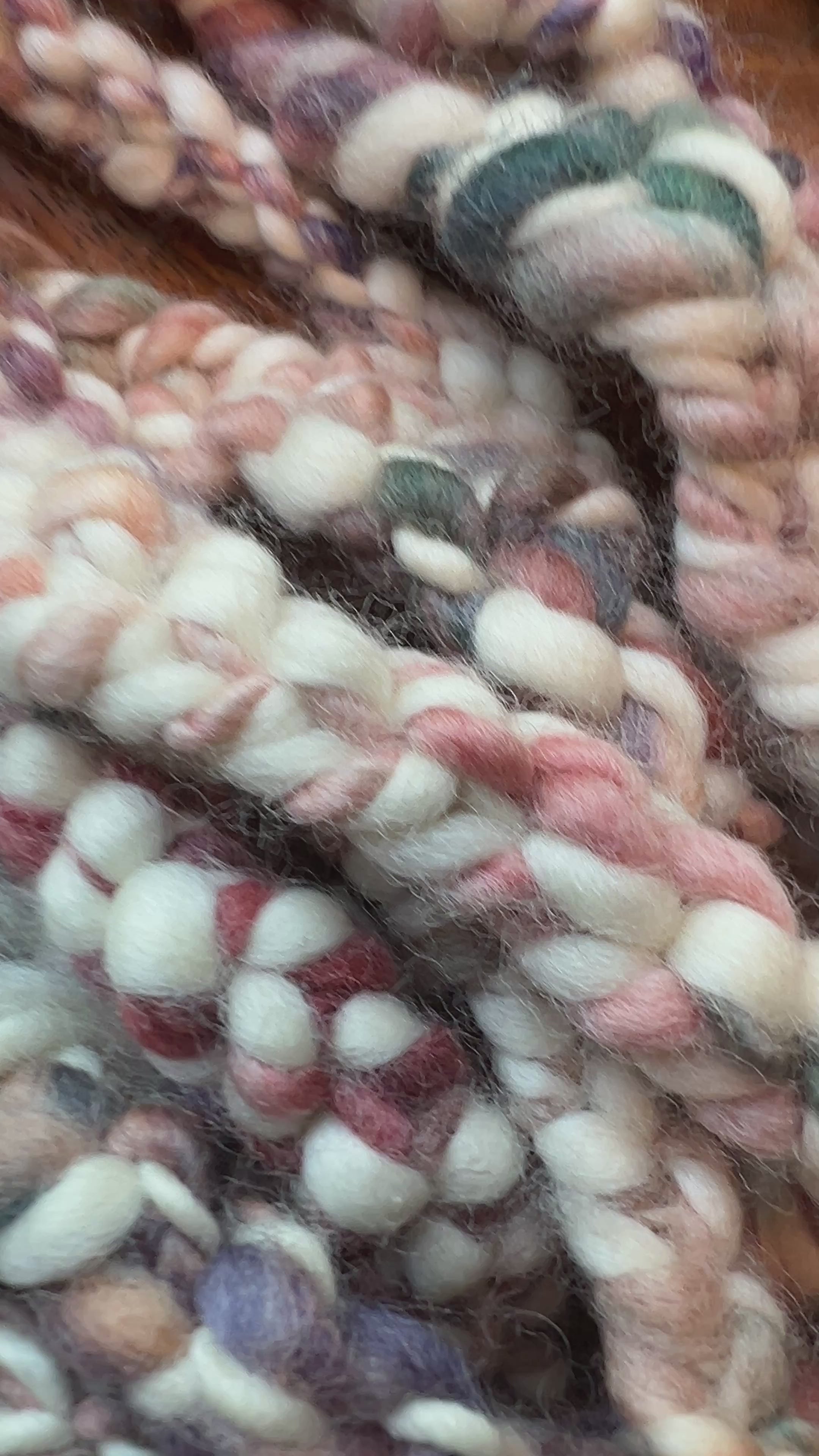 a video of Painted Skein hand-dyed hand spun, hand crafted in Minneapolis, Sedona Market trim featuring a multi-colored trim palette of teal, terracotta, purple-lavender, and sage beautifully contrasted against a crisp cream base.