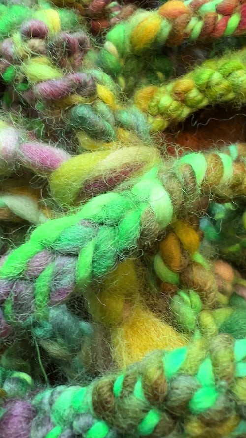 Cottage meadow hand-dyed hand spun hand crafted crochet trim in greens, purples, gold and red tones.
